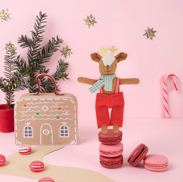 Mini reindeer doll in a suitcase