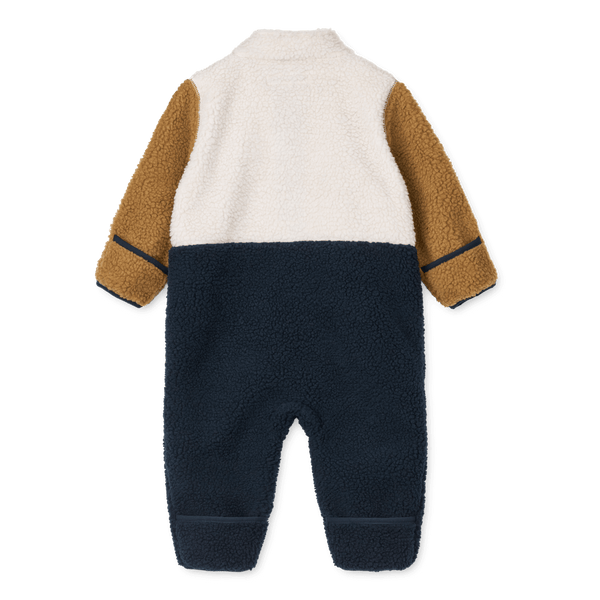 Nolano Baby Pile Overall in Navy Mix, featuring a cozy fleece texture and stylish color blocking design.