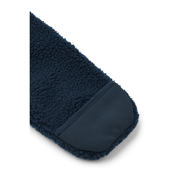 Close-up of the soft navy sleeve of the Nolano Baby Pile Overall, showcasing cozy material and secure hem.