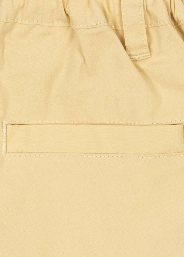 Konges Sløjd Chinos in Parsnip – Detail von Bund und Taschen