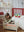 Puppenbett Big Cherry von Konges Sløjd mit Puppe im Kinderzimmer