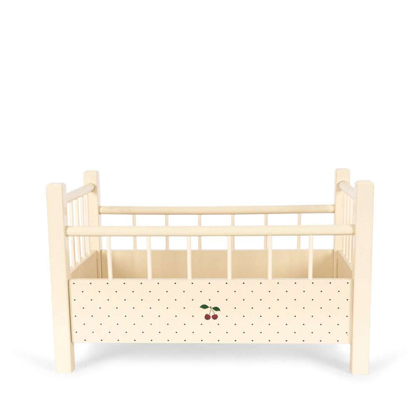 Seitenansicht des Konges Sløjd Puppenbetts Big Cherry aus Buche und Teak