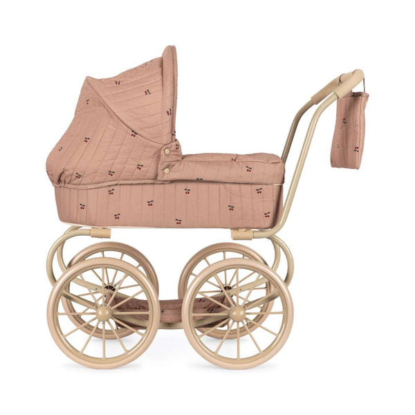 Baumwollbezug in Cherry Blush auf dem Stahlgestell des Minnie Puppenwagens