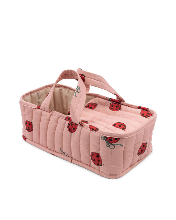 Pink ladybug-patterned toy carrycot from the Bonnie Puppen Geschenkset for children.