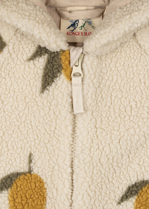 Close-up of Jody Teddyoverall by Konges Sløjd featuring soft fleece fabric, hood, and front zipper. Perfect for cold weather.