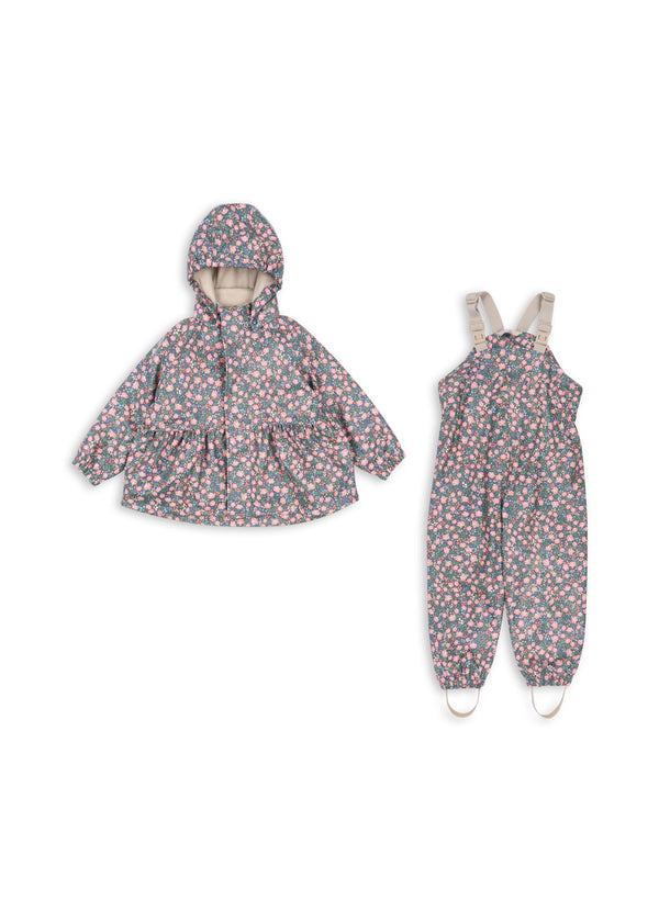 Palme Rüschen-Regenset Kyoto: Wasserdichte Jacke und Latzhose mit floralem Design für Kinder. Perfekt für jedes Wetter.