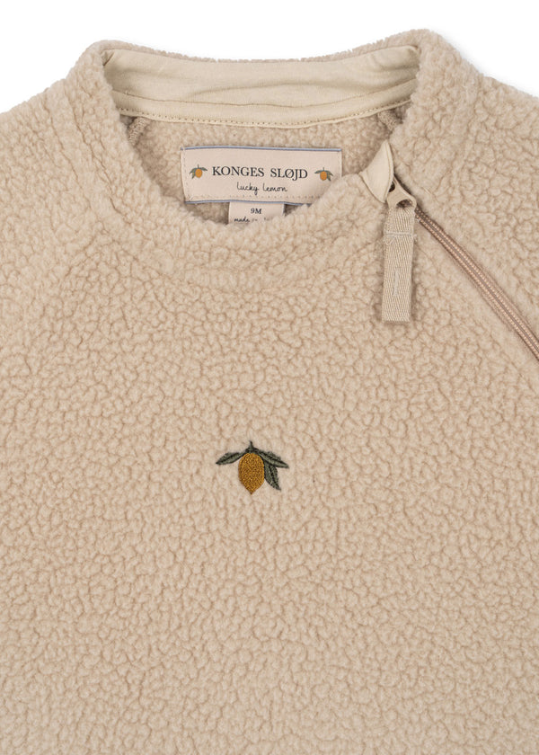 Konges Slojd kids' fleece sweater featuring a cozy design and embroidered lemon detail.
