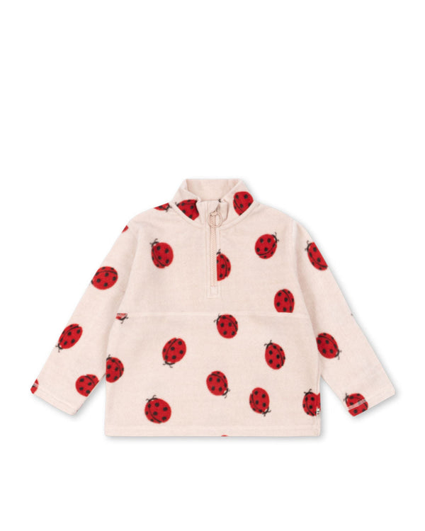 Tavi Fleece-Sweatshirt with ladybug print, featuring a high collar and zip for cozy warmth and style.