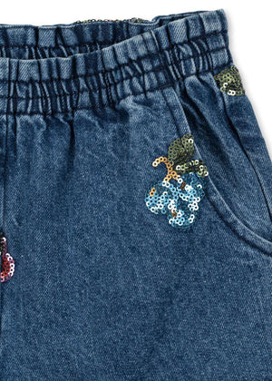Kind in der Konges Sløjd Magot Pailletten-Jeanshose Vitamins
