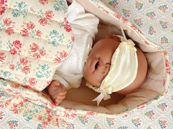 Lea in doll carrycot