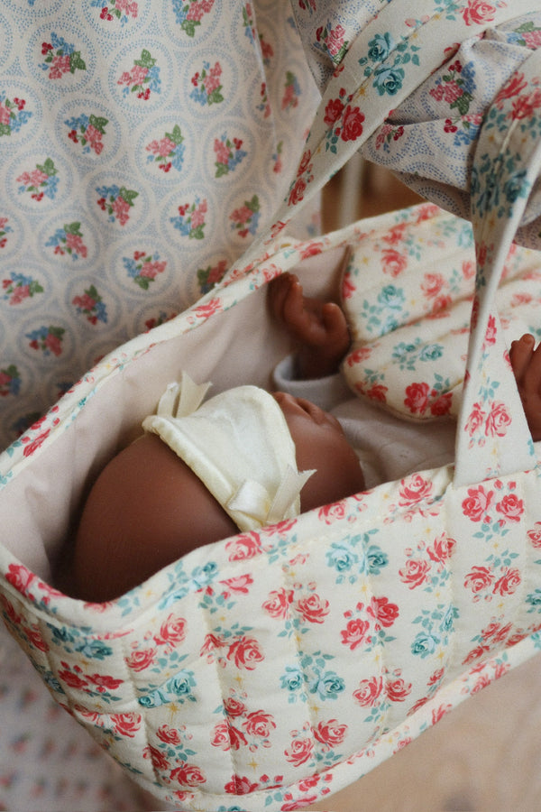 Lea in doll carrycot